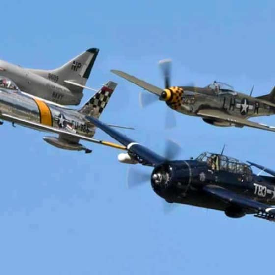 Four planes flying in formation at the Northern Illinois Airshow.