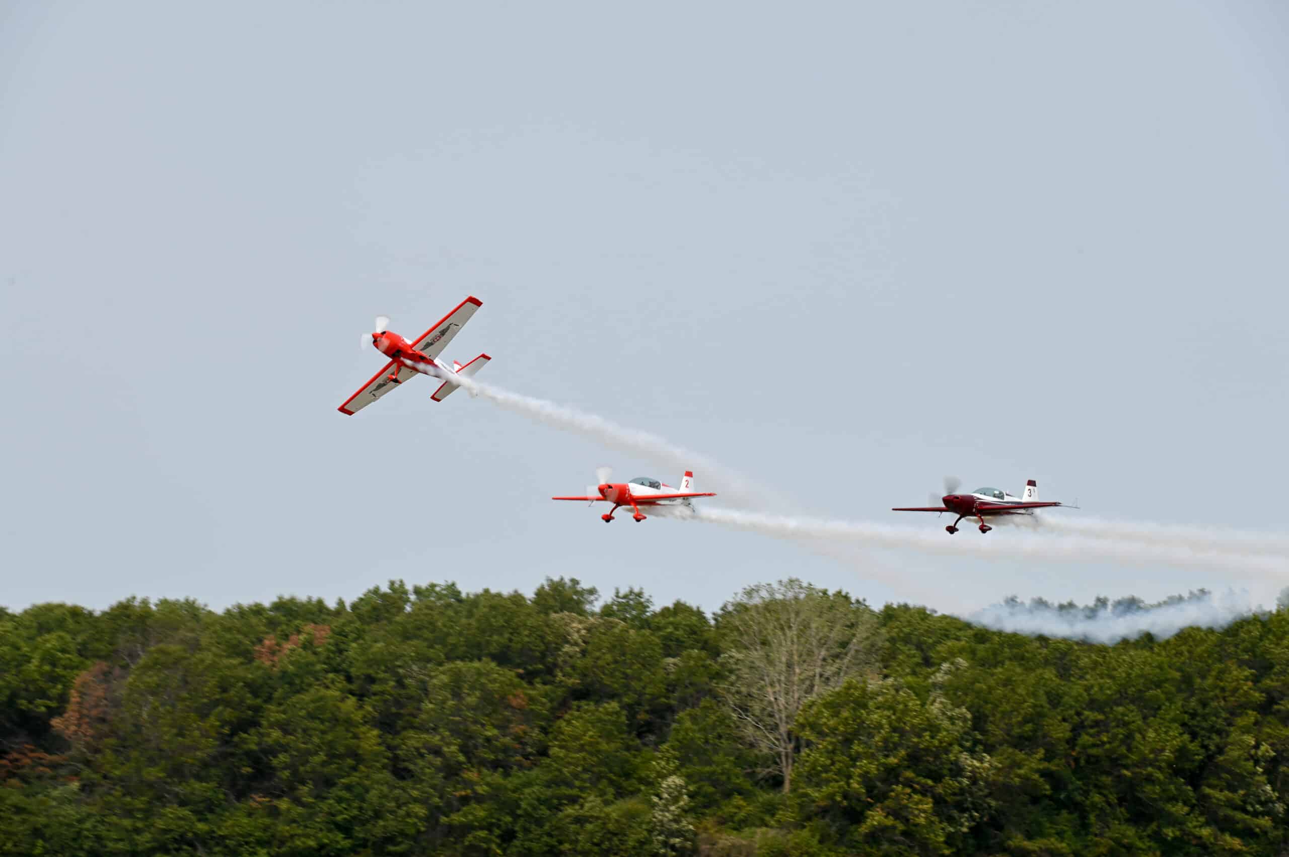 Three planes flying in rank. 